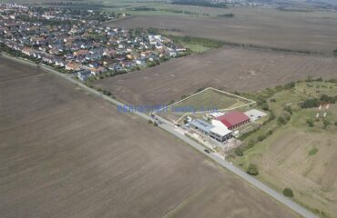 Pozemek ke komerční zástavbě, Bašť, prodej